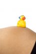 30 weeks pregnant teenager with music duck on her belly