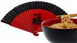 noodle soup asian with chopsticks and red fan