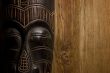 African mask over wooden background