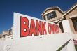 Bank Owned Real Estate Sign and House with American Flag