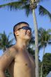 Happy asian man at beach