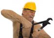 Plumber with pipe wrench and safety helmet