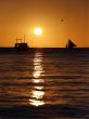Drifting boat on a sunset