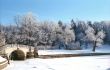 Winter river with old bridge
