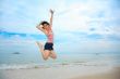 happy fun jump at the beach