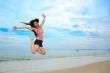 happy fun jump at the beach