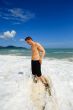 Man standing on exotic beach