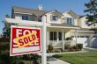 Sold Home For Sale Sign and House