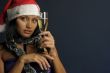 beautiful woman drinking champagne into Christmas