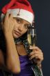 beautiful woman drinking champagne into Christmas