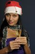 beautiful woman drinking champagne into Christmas