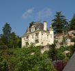 Old castle on the hill over the river in France