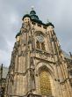 High belltower of city cathedral in Prague