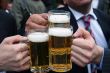 business men toasting with their beers