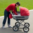 Woman with baby carriage