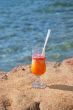 fresh juice orange and papaya on the beach of the sea