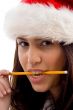 female wearing christmas hat holding pencil