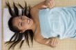 laying young woman showing thumb up