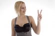 smiling woman making peace sign