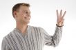 man with counting hand gesture