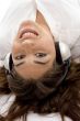 young female lying and wearing headphones