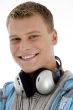 man with headphones around his neck