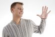 young man with counting hand gesture
