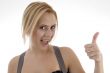 smiling woman showing thumbs up