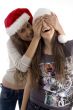 sisters in christmas hat playing