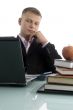 young businessman looking into laptop