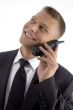 young businessman smiling and talking on phone