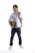 student standing with books and bag