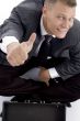 handsome young businessman with thumbs up