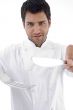 portrait of male chef holding cutlery