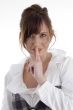 smiling woman instructing you to keep silent