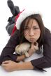 laying woman with christmas hat and pug