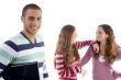 two girls holding to each other and guy