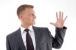 portrait of businessman counting fingers