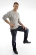 smiling man standing on one leg