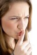 teen female face showing keep shushing sign
