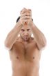 muscular man posing with knife
