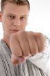 smiling man showing punch