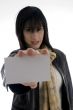woman holding identity card