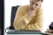 thinking male while looking on screen