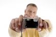 portrait of man showing camera