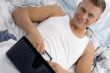male putting laptop on his stomach