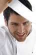 close up of male chef holding knife