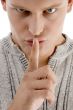 close up of man instructing you to be silent