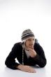 young male lying and wearing woolen cap