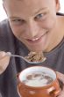 smiling handsome man going to eat cornflakes